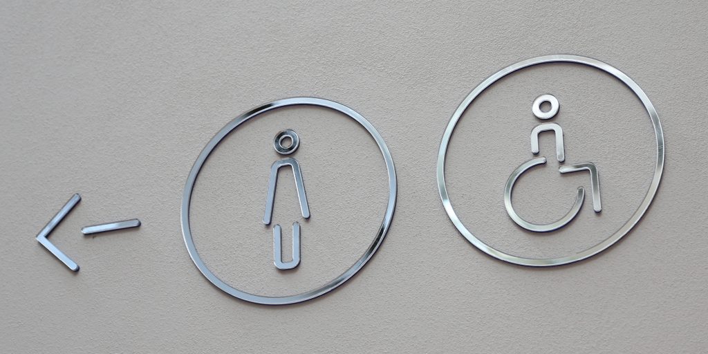 Female and accessible toilet signage in stainless steel