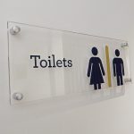 Plexiglass male and female toilet gender signage