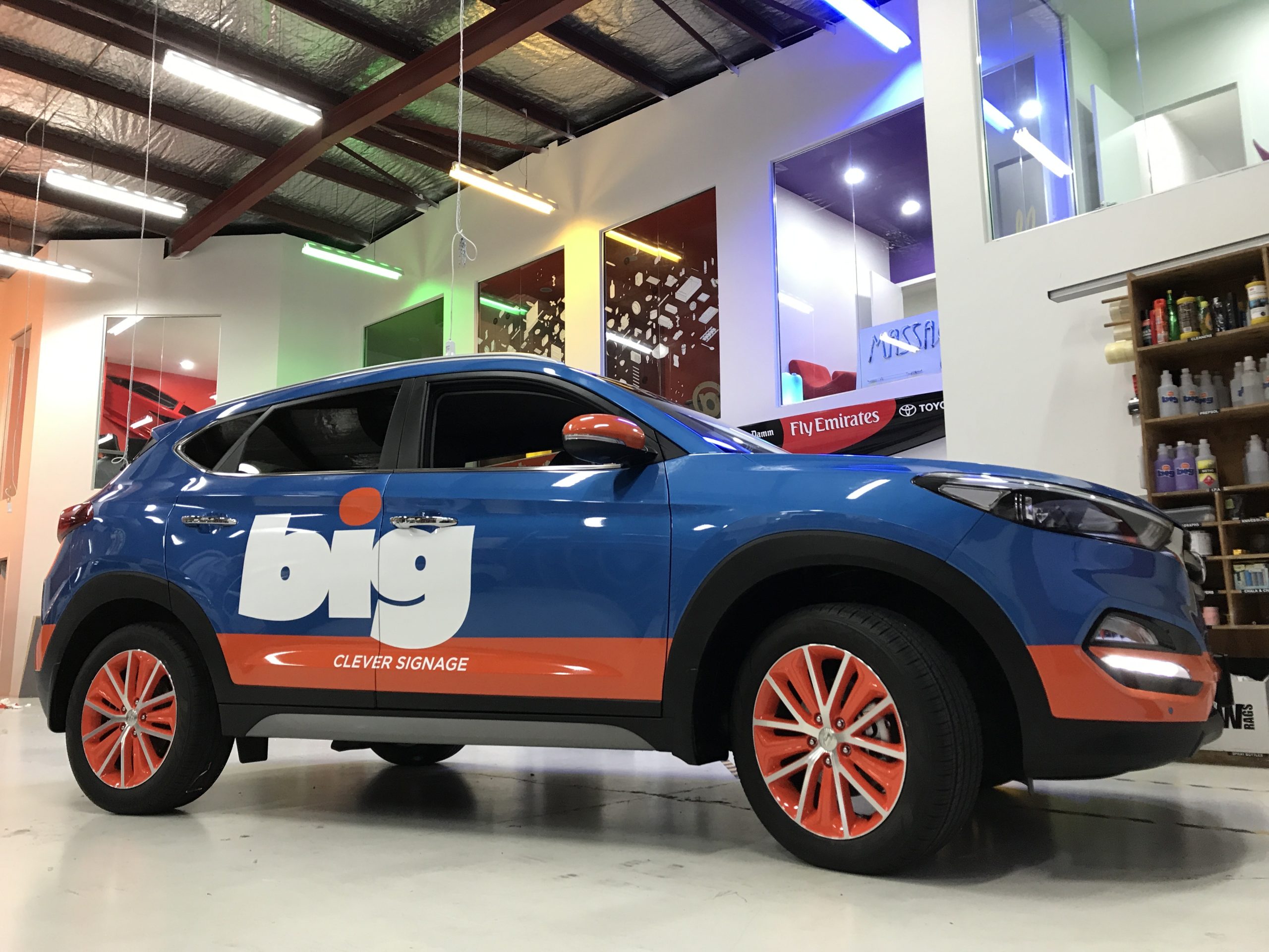BIG Ideas signwritten Mazda SUV, with blue and orange wrap