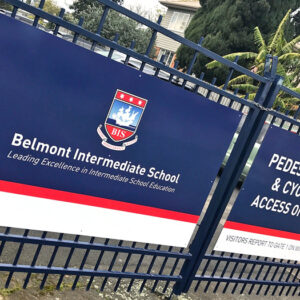 Belmont Intermediate School sign mounted to school fencing