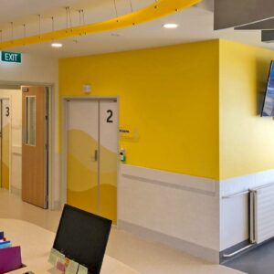 Starship outpatient room wrapped with yellow designs and yellow walls