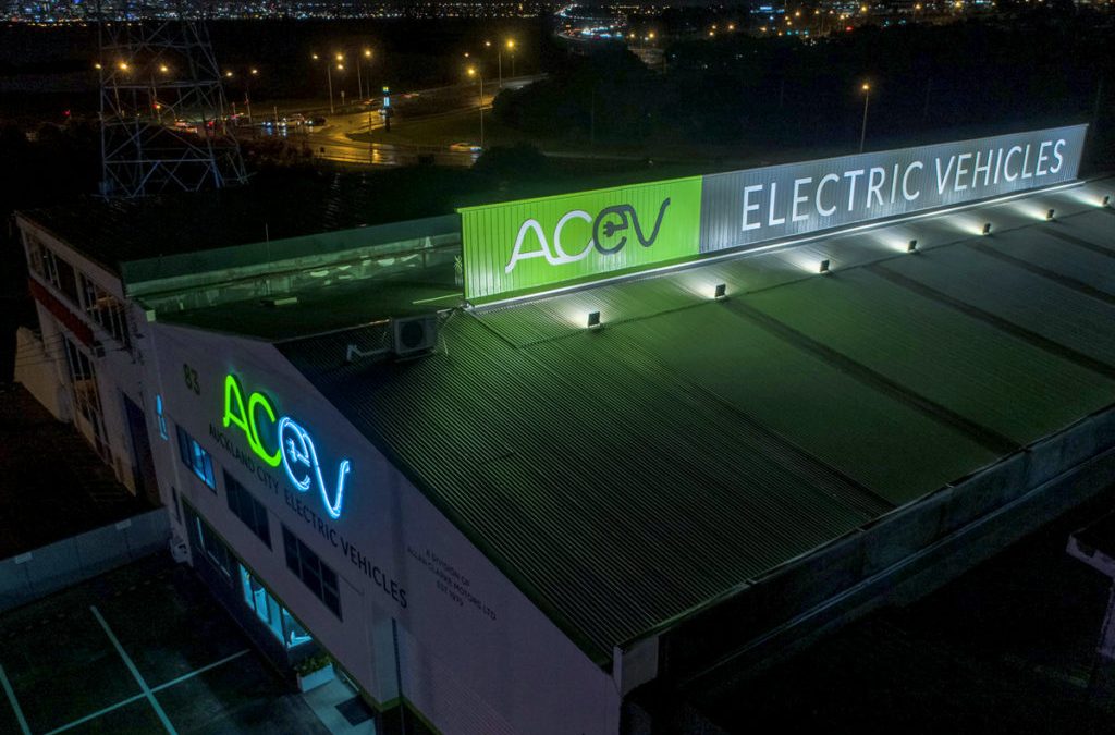 Electric Vehicles - AC EV business sign, mounted to the top of building