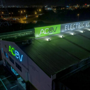 Electric Vehicles - AC EV business sign, mounted to the top of building