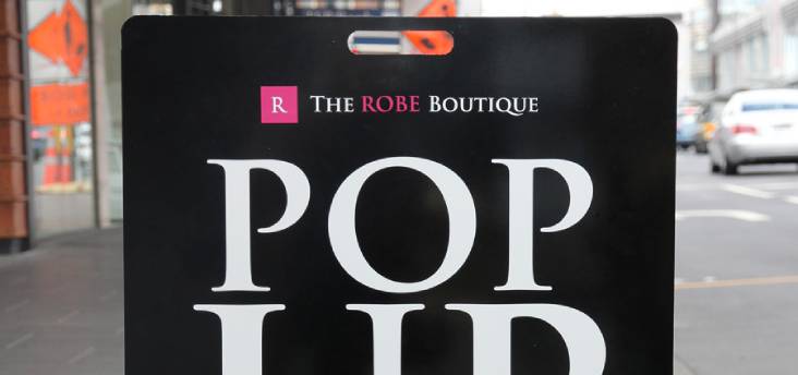 The Robe Boutique footpath sign