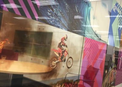 Digitally printed window wrap, featuring a dirt bike jumping into the air