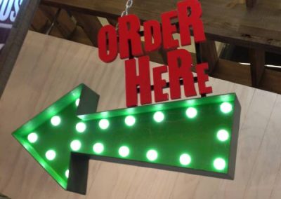 Order Here wayfinding arrow setup for Mad Mex