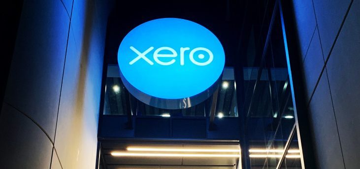 Brightly lit Xero signage shown in business walkway