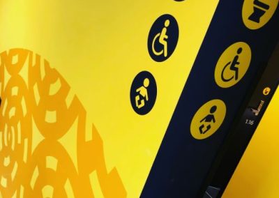 Toilet wayfinding signage, in striking yellow wrap