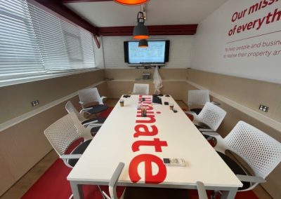 Luminate business board room with signwritten table, and wall