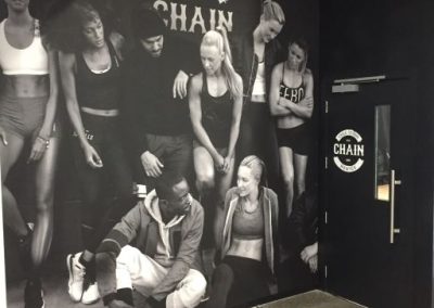 Cycle Studio black and white wall mural, showing gym members