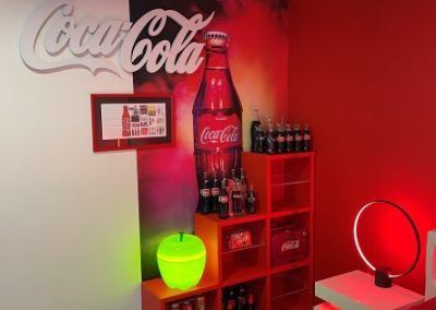 Coca Cola wall and display, with giant wrap of Coca Cola bottle