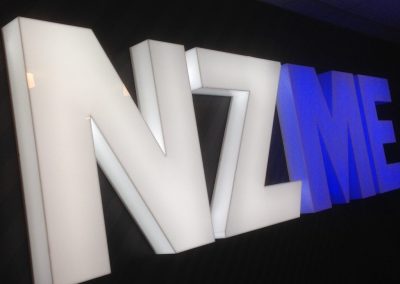 NZME illuminated white and blue signage