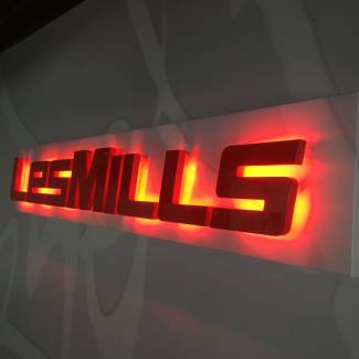 Red and Orange backlit signage for Les Mills